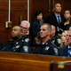 Members of the Boston Police Department, including Police Commissioner William Evans (right) and Superintendent-in-Chief William Gross (second from left), listen to proceedings during a hearing over the issue of body cameras for Boston police officers at Suffolk Superior Court in Boston on Sept. 6, 2016.
Jessica Rinaldi/The Boston Globe via Getty Images